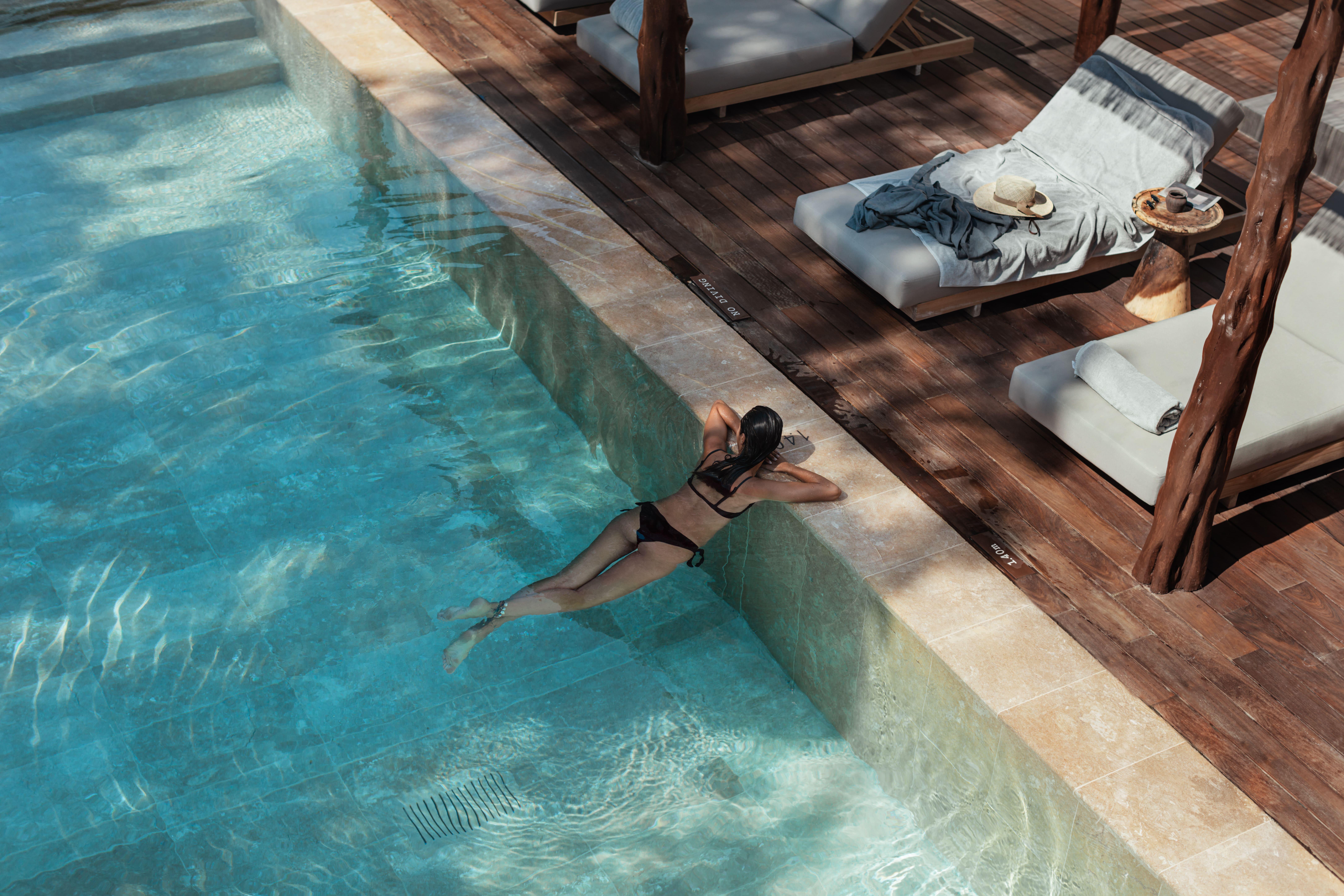 Oku Ibiza (Adults Only) Hotel San Antonio  Exterior photo A woman swimming in a pool
